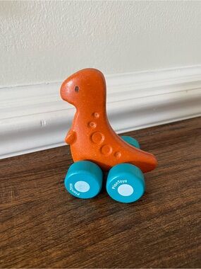 Plan Toys Orange Dinosaur Push Toy with Blue Wheels